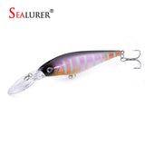 Sealurer floating fishing lure in 11cm length and black/violet/orange/grey decor on white background